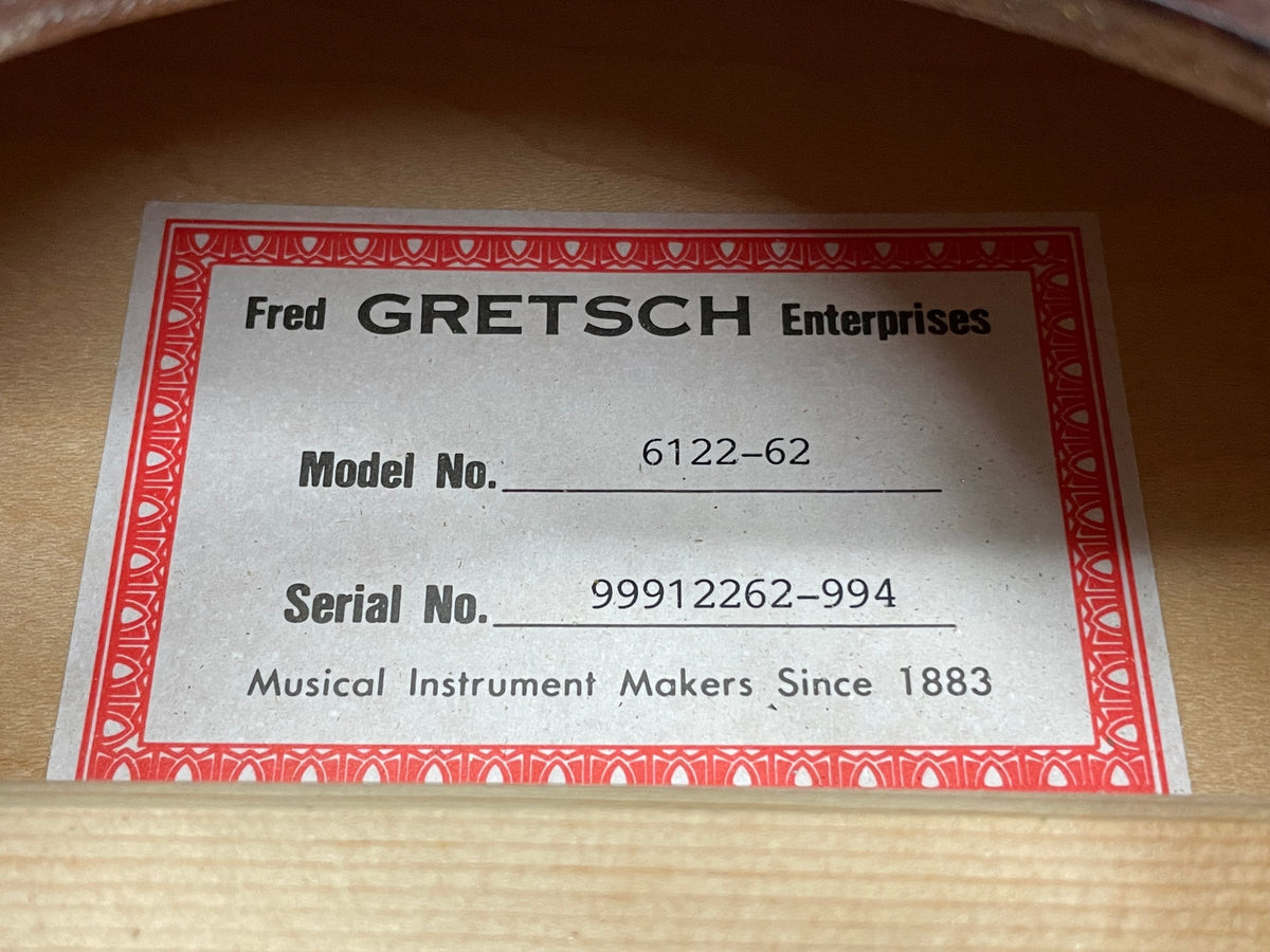 Close-up of the guitar's interior label, showing "Model No. 6122-62" and "Serial No. 99912262-994" on a light grey card with a red border.
