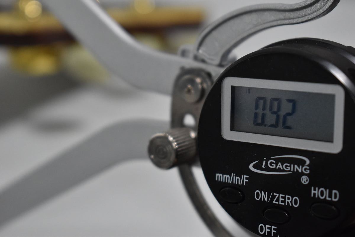 A digital caliper shows a reading of 0.92 inches.
